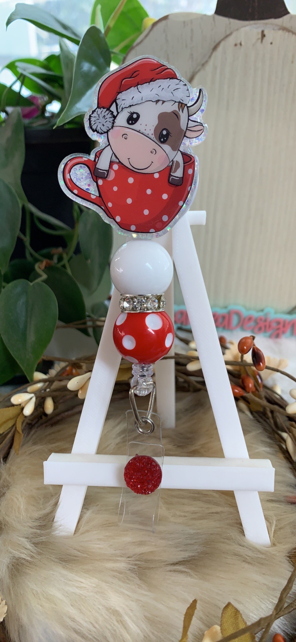 Christmas Cow in a Cup Badge Reel